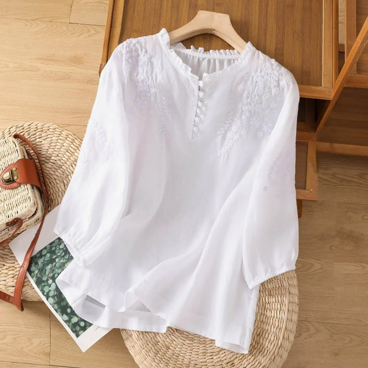 Lightweight women's floral blouse, elegant button-front design. Ideal for summer and spring fashion.