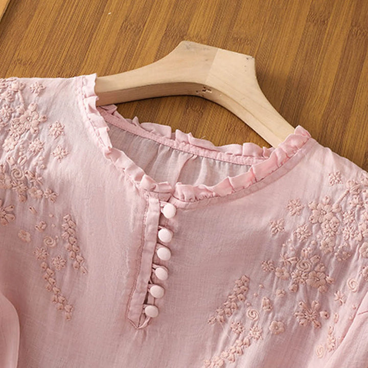 Women's elegant floral button-front top. Casual chic blouse, great for versatile spring outfits.