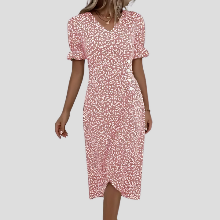 Flowy floral midi dress for women, featuring a button-front and short sleeves, great for comfortable spring & summer wear.