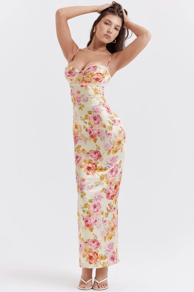 Gorgeous floral maxi wedding guest dress with corset detail. Elegant evening wear for women.