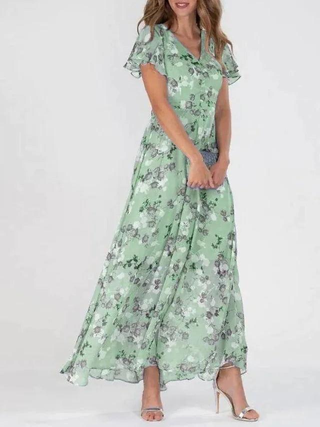 Flowy floral print maxi dress for women, featuring elegant flutter sleeves & a chic V-neck. Ideal for spring.