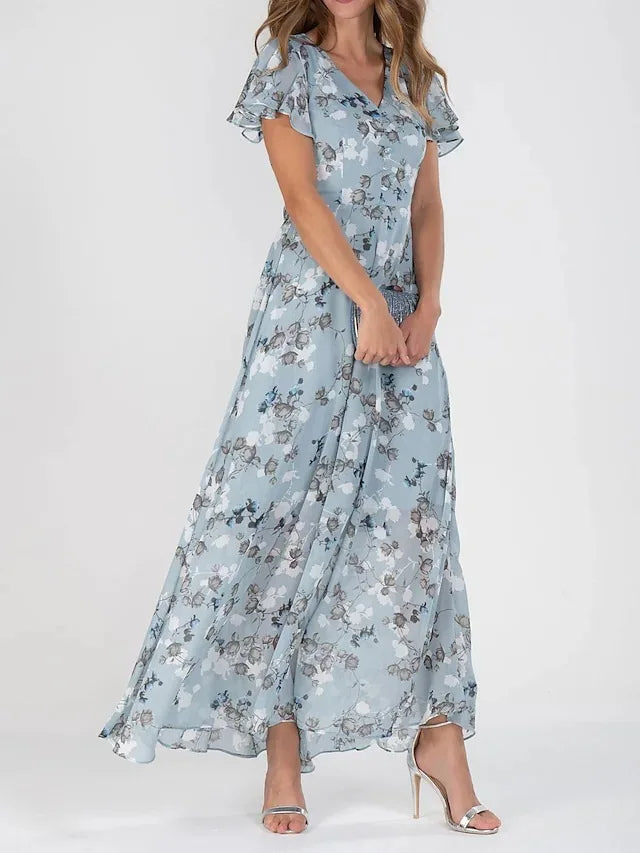 Stylish women's long floral flutter sleeve V-neck dress, offering an elegant look for any warm-weather event.