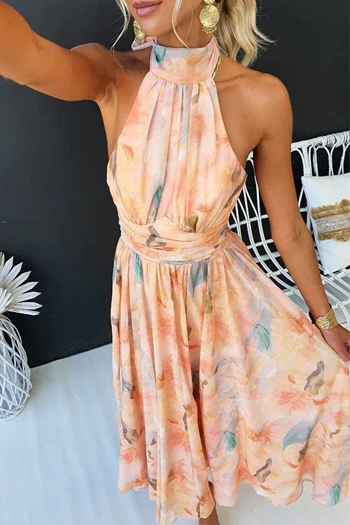 Flowy elegant women's maxi dress with a floral pattern & halter neckline for any special event.