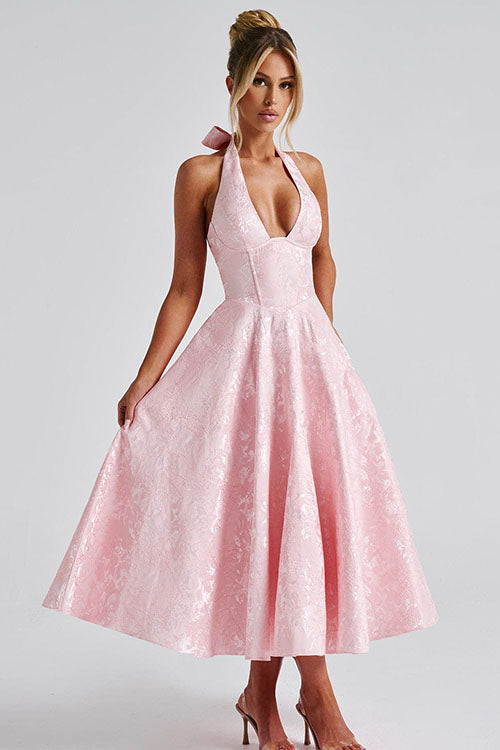 Romantic wedding guest dress, midi length, floral pattern, with a chic halter and corset.