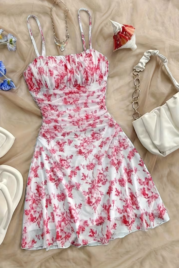 Vibrant red floral halter mini dress, lightweight and flared, ideal for a chic day or evening look.