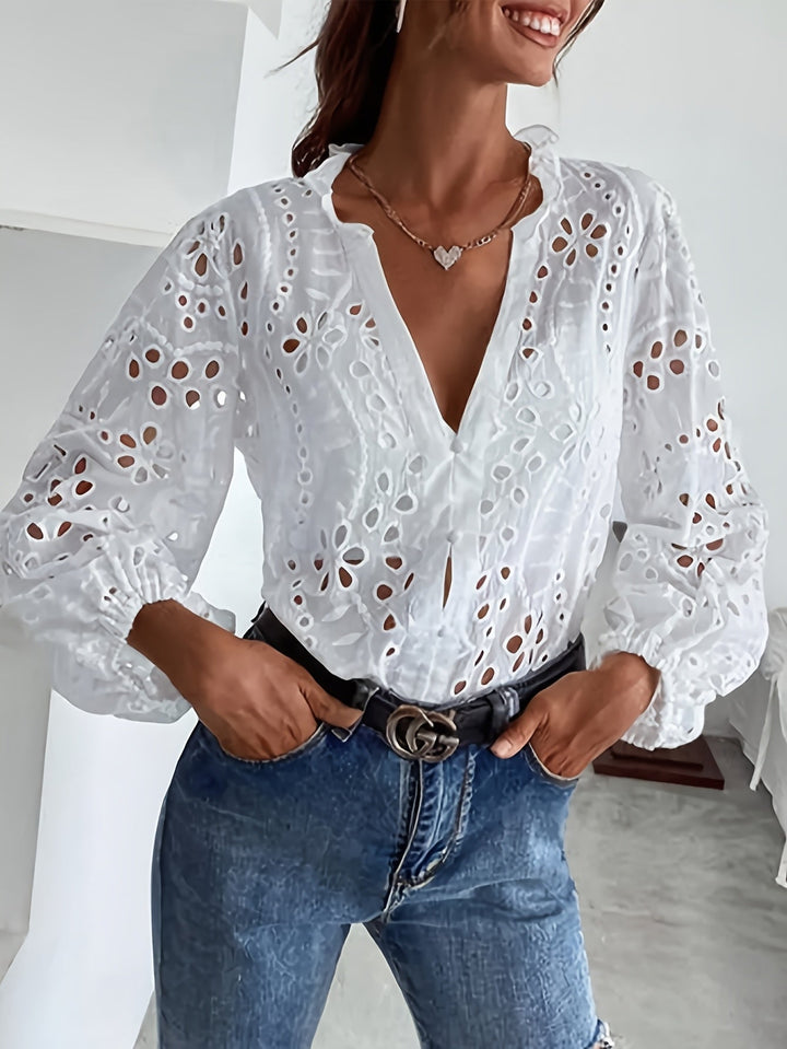 Sophisticated women's floral print long-sleeve button-up blouse, versatile for office or casual spring outfits.