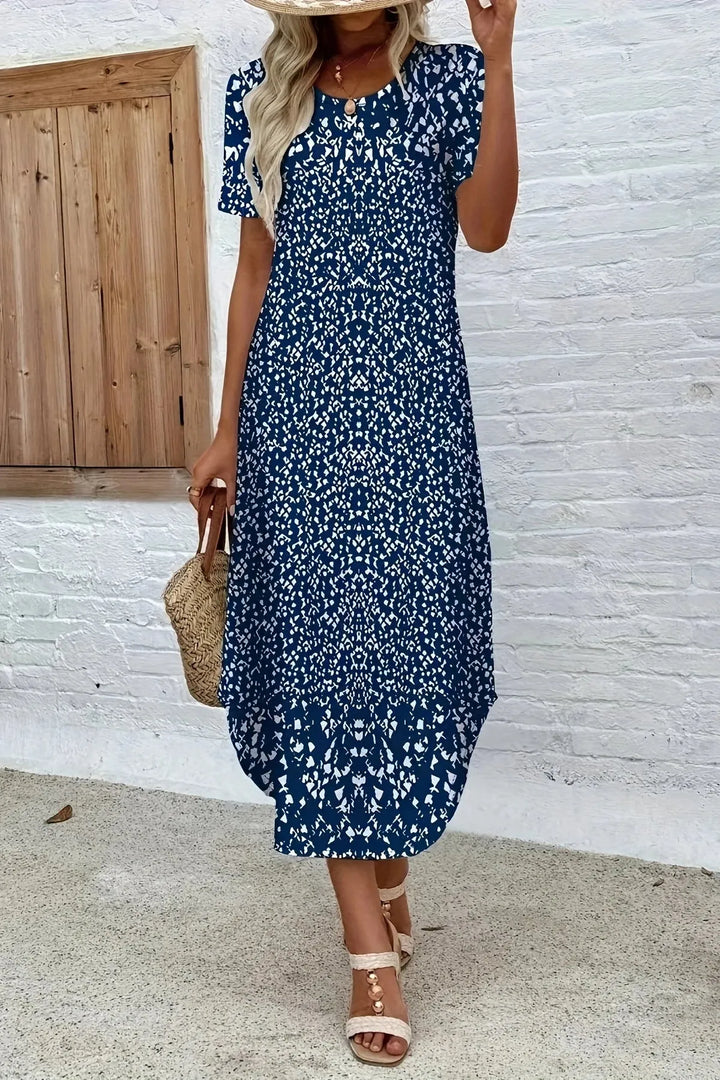Long, flowy women's summer maxi dress with vibrant floral print, comfortable and elegant for any event.