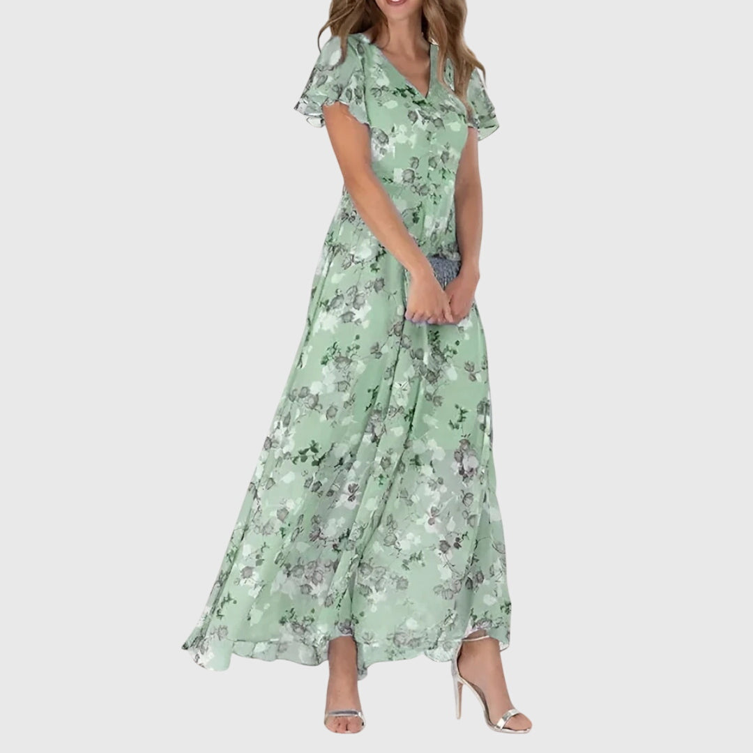 Long floral maxi dress for women with flutter sleeves & flowy design, ideal for evening parties & events.