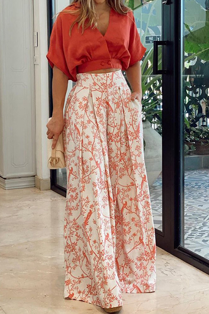 Stylish women's two-piece floral maxi skirt and crop top outfit. Great for elegant casual or vacation.
