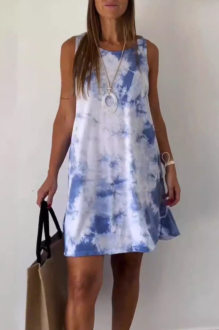 Close-up of a stunning floral print on an elegant women's midi dress. Features a flattering cut for spring/summer.
