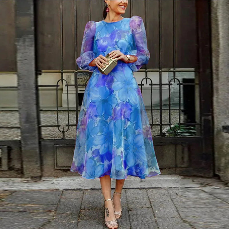 Beautiful women's floral print A-line midi dress, featuring puff sleeves & round neck, ideal for formal wear.