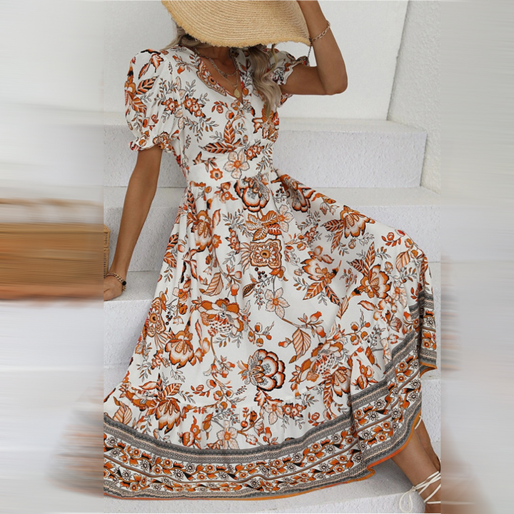 Women's flowing A-line floral maxi dress with elegant puff sleeves, perfect for summer occasions.