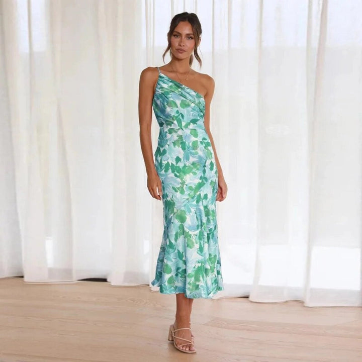 Summer wedding guest dress: vibrant floral one-shoulder midi for elegant party wear.