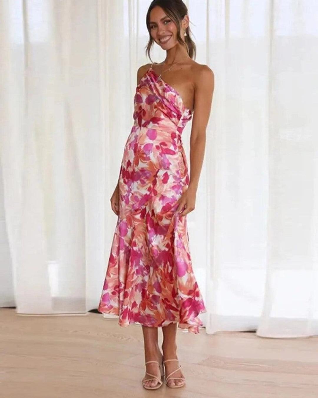 Elegant bias cut floral midi dress, a stunning one-shoulder design for wedding guest attire.