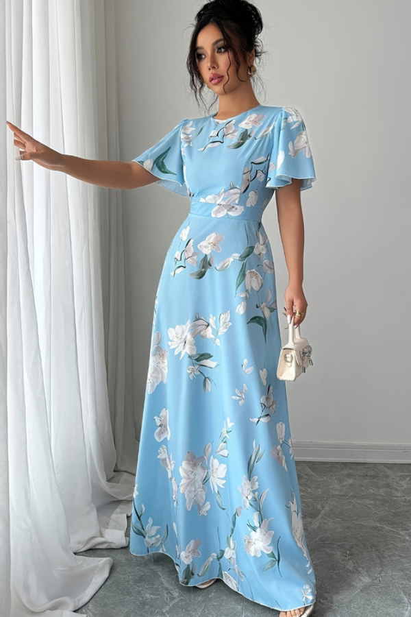 Vintage-inspired women's floral midi dress with delicate pleats, ideal for a refined look.