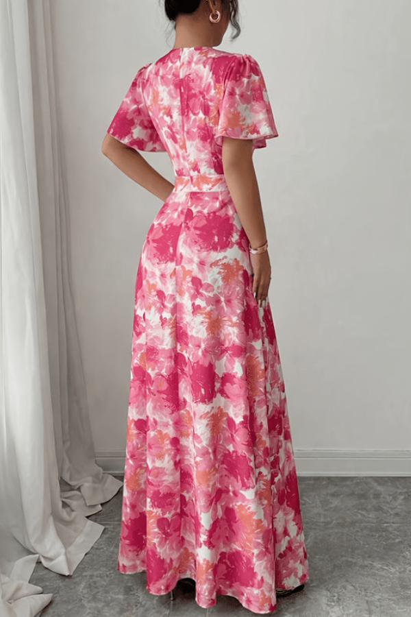Spring/Summer women's floral midi dress, daintily pleated for an elegant and feminine silhouette.