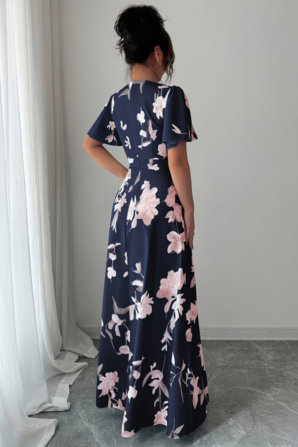 Flowing floral pleated midi dress for women, an elegant choice for any spring or summer occasion.