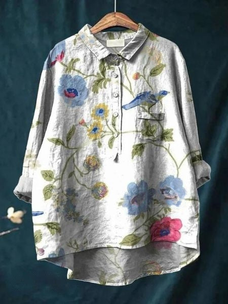 Elegant long-sleeve floral blouse, suitable for both casual and office wear.