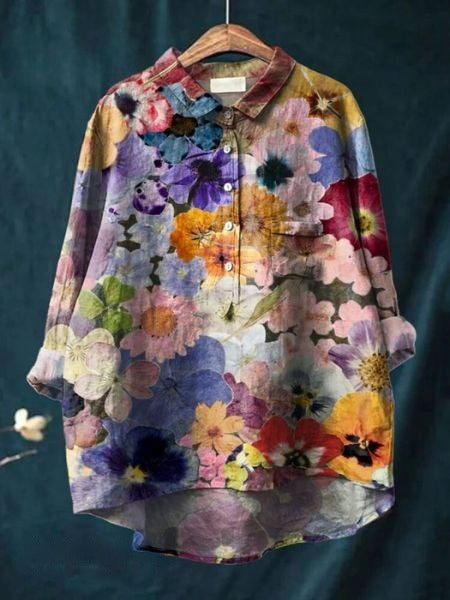 Elegant long-sleeve women's top with beautiful floral print detail.