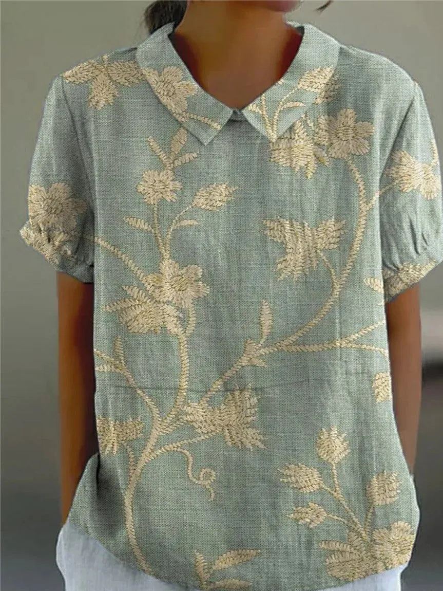 Elegant women's floral print blouse, perfect for versatile spring and summer fashion.