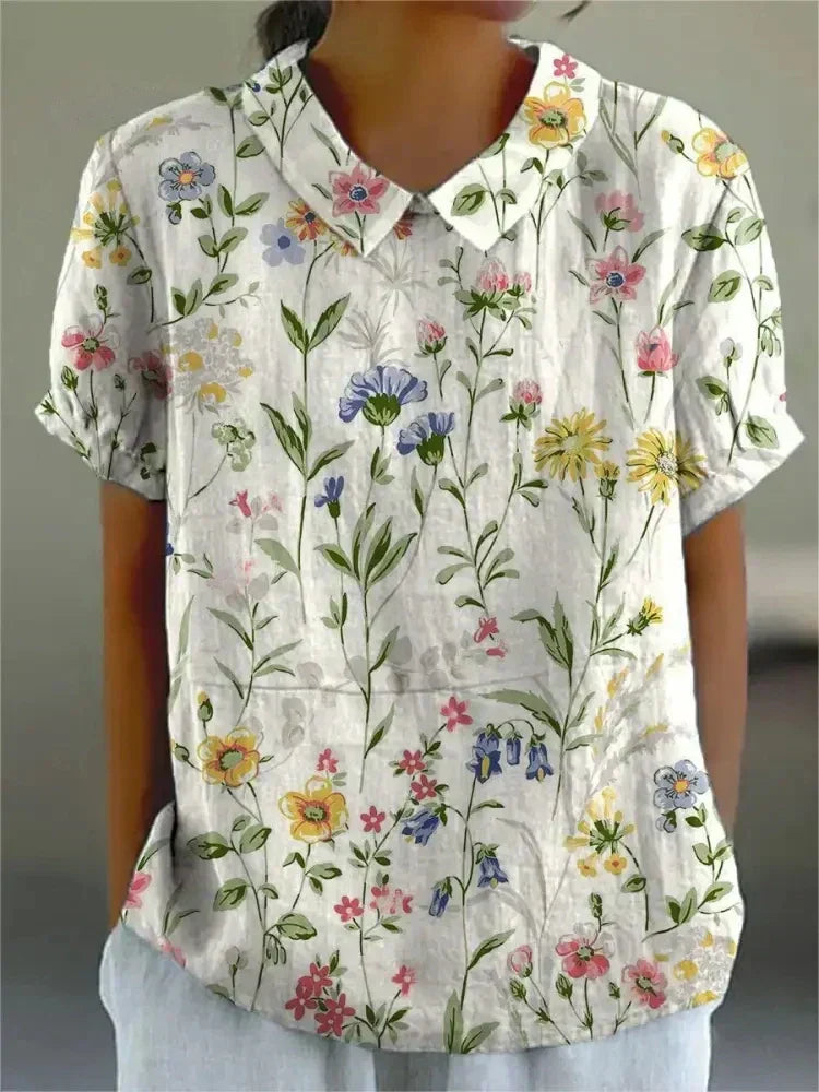Lightweight women's floral blouse with relaxed fit, ideal for casual everyday wear in summer.