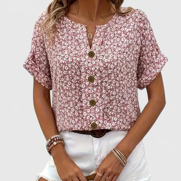 Versatile women's flowy button-up blouse with vibrant floral print. Comfortable long sleeve top for spring/summer.