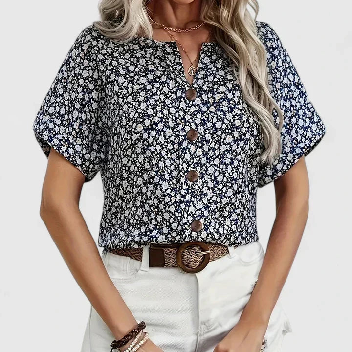 Chic women's long sleeve floral blouse, featuring a flowy fabric and elegant button-up design. Ideal for summer.
