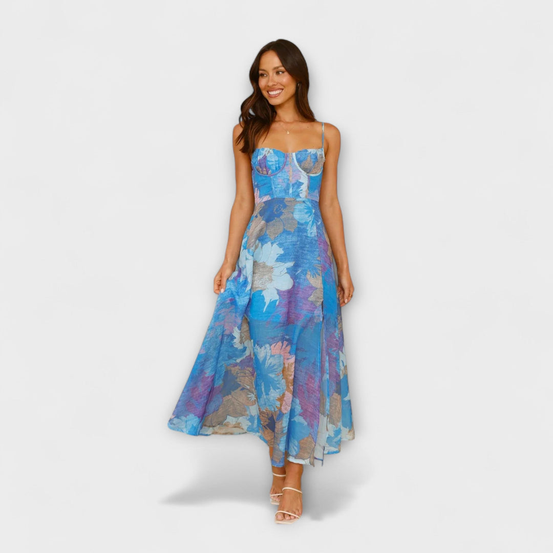 Back view of women's elegant floral print midi dress, highlighting the stylish tie-back. Perfect for special occasions.