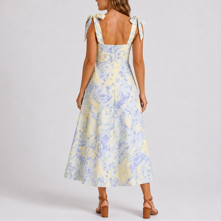 Stylish women's summer floral print midi dress with ruched detailing, ideal for casual outings or spring events.