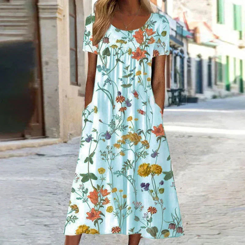 Relaxed fit floral short sleeve midi dress for women, ideal as a comfortable vacation or casual summer dress.