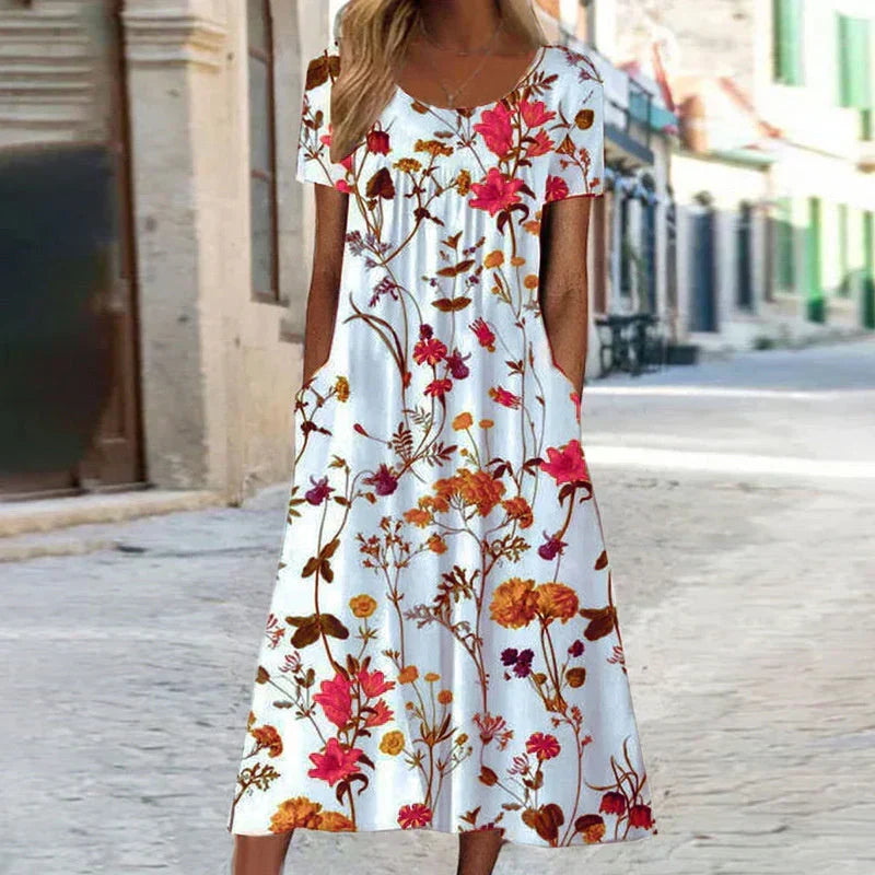 Chic women's floral short sleeve midi dress with an elegant print, perfect for comfortable summer and spring wear.