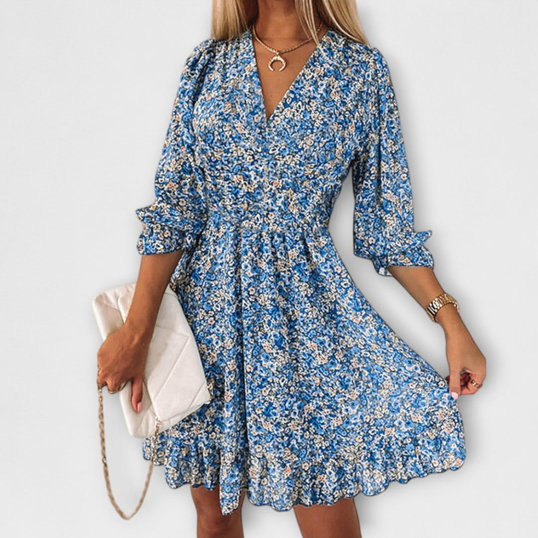 Women's midi floral dress with puff sleeves, a chic choice for spring fashion & vacation outfits.