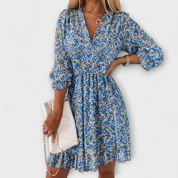 Comfortable floral puff sleeve summer dress for women, offering an elegant yet casual vacation look.