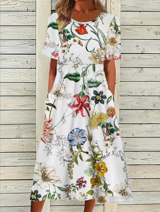 Chic women's floral midi dress with short sleeves. A comfortable & feminine dress for effortless spring/summer style.