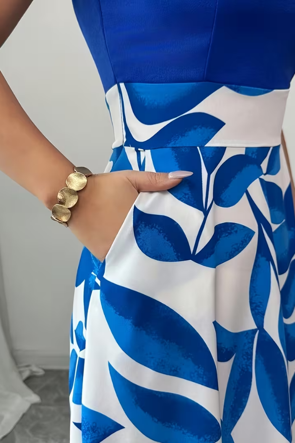 Beautiful women's floral print V-neck maxi dress with a flowy A-line skirt and hidden pockets for essentials.