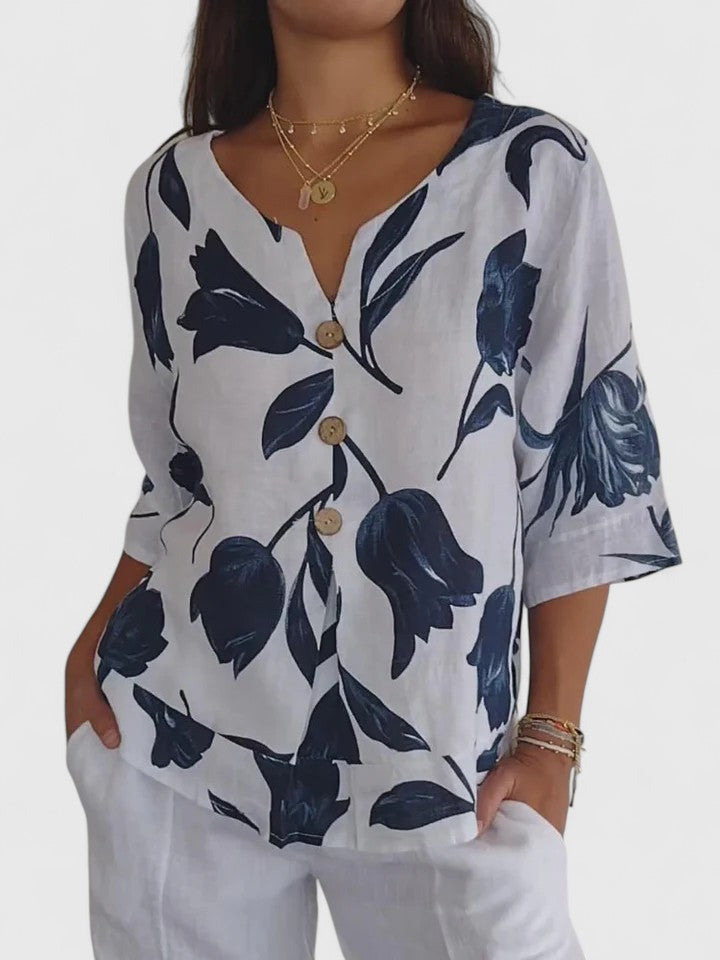 Elegant women's floral V-neck blouse, comfortable for everyday wear. Chic ladies' apparel with a versatile print.