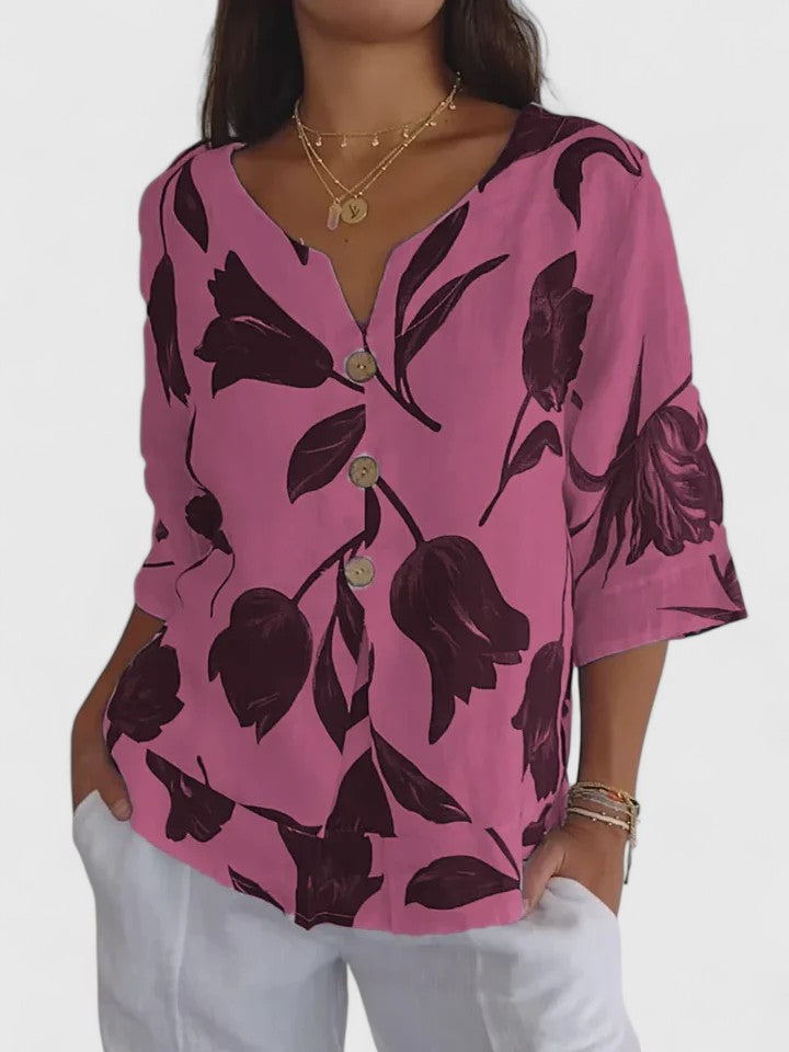 Vibrant floral V-neck blouse for women. Comfortable & elegant everyday top, perfect chic ladies' apparel.