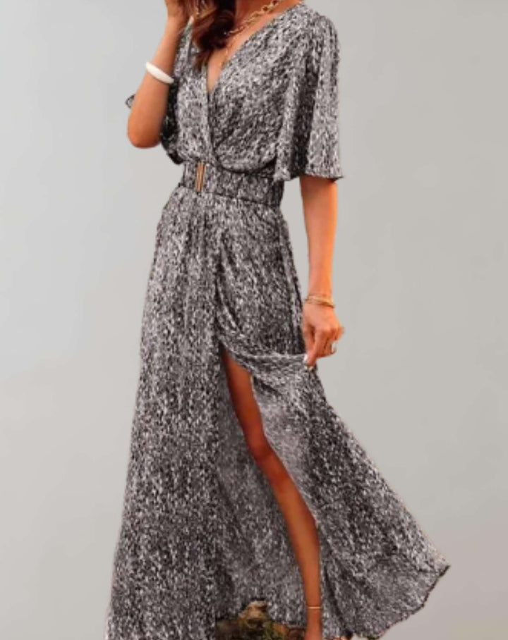 Side slit detail on elegant women's floral maxi dress, showing flowy hem & casual chic summer fashion.