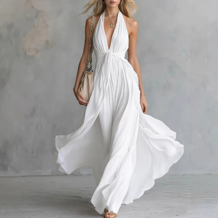 Summer flowing halter maxi dress for women, featuring a backless design and flattering side slit, ideal for vacation.
