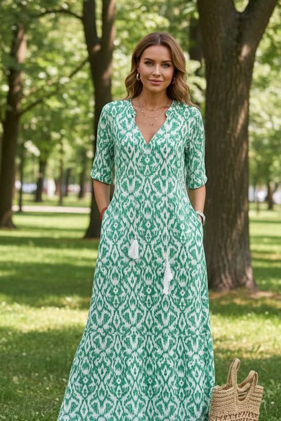Fashionable women's resort wear maxi dress, featuring a bright, flowing design for summer elegance and vacation style.