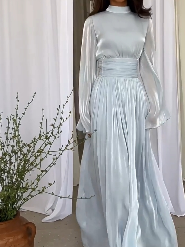 Playful yet elegant women's flowing maxi dress for comfortable summer casual wear, beach, or resort fashion.