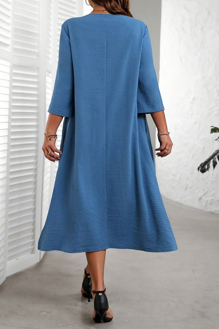 Women's chic flowing midi dress, effortless style for casual or elegant spring/summer outfits. Comfortable fashion.