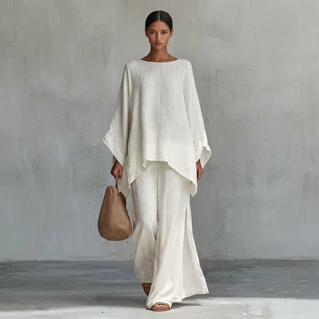 Elegant women's flowing two-piece set featuring an oversized tunic top and a maxi skirt, ideal for resort wear.