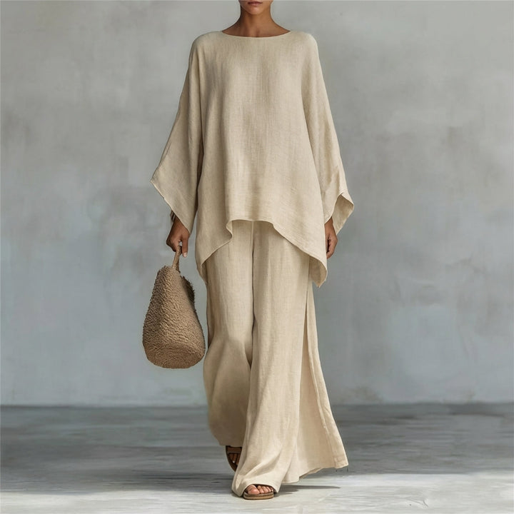 Women's summer two-piece set: a long-sleeve oversized tunic top and a high-waisted flowy maxi skirt, casual chic.