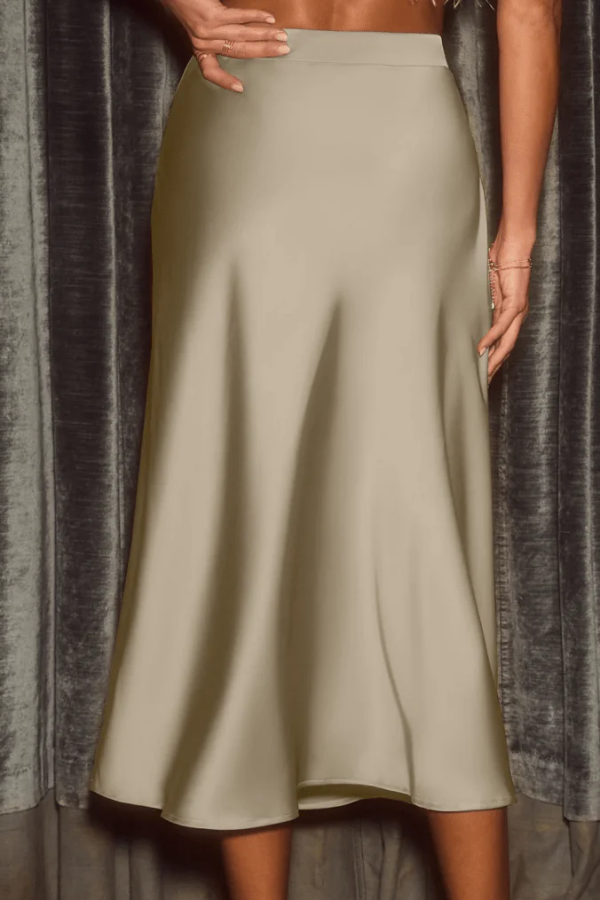 Chic women's flowy midi skirt, elegant A-line high-waist, perfect for office, date night, or summer style.
