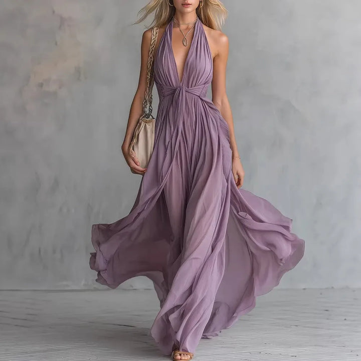 Elegant women's flowy pleated backless maxi evening dress with halter neck for formal special occasions.