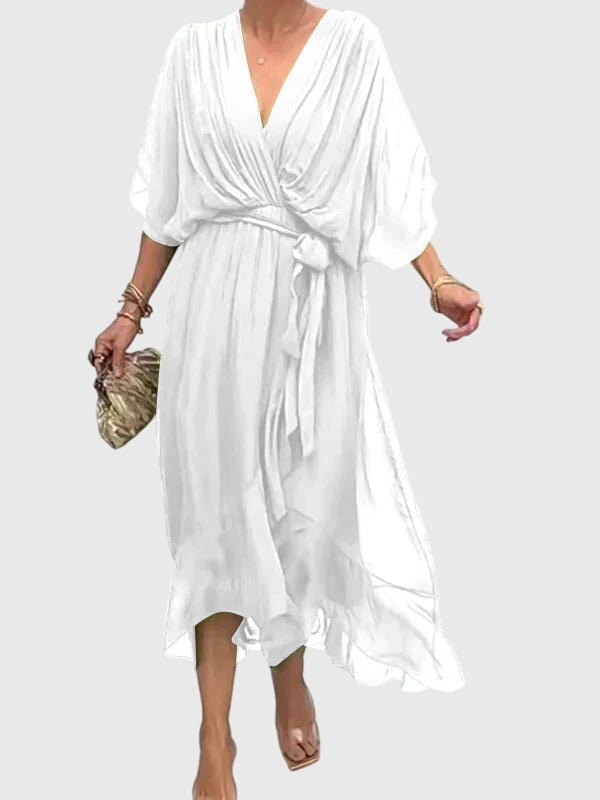 Stylish women's elegant flowy maxi dress in a vibrant shade, perfect for summer events.