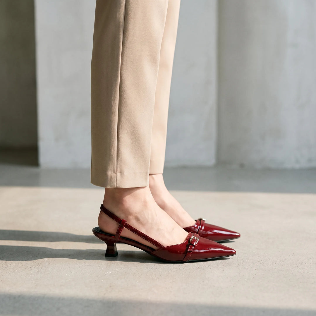 Elegant women's glossy pointed toe slingback heels, ideal for formal wear, work, or dressy events. Adjustable strap.