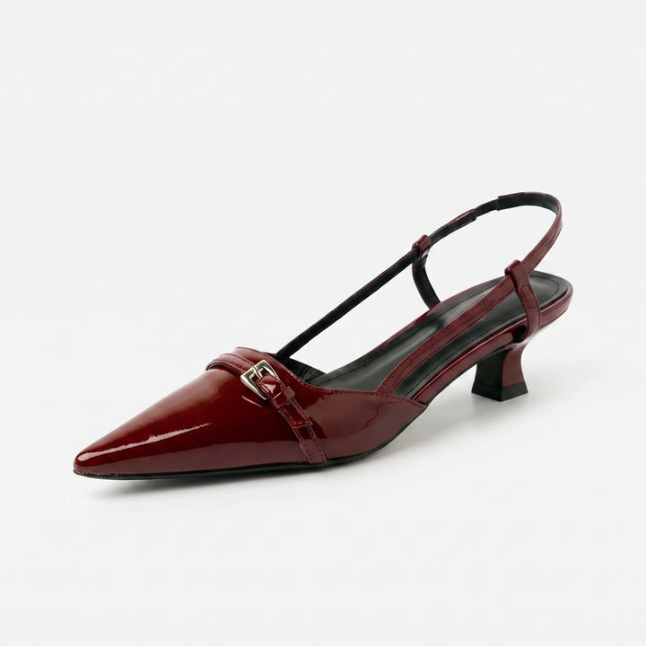Side view of elegant women's glossy pointed toe slingback heels, featuring a slender heel & secure adjustable strap.