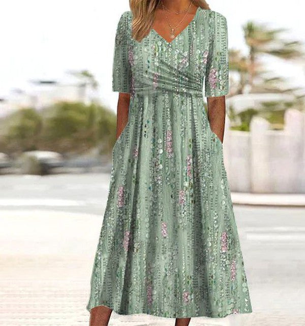 Elegant women's green floral A-line midi dress. Perfect for summer parties, casual wear, or versatile styling.